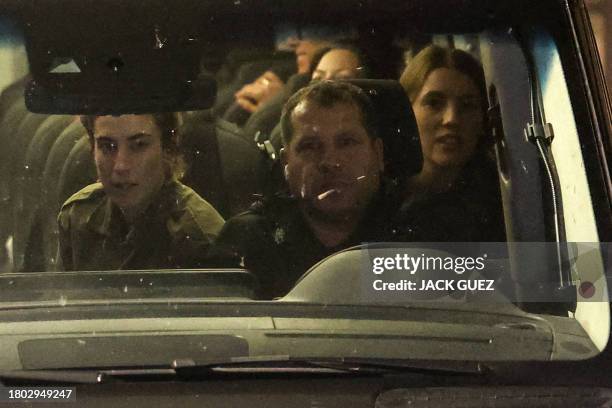 Vehicle carrying Israeli hostages released by Hamas from the Gaza Strip arrives at the Sheba Medical Center in Ramat Gan, early on November 26, 2023....