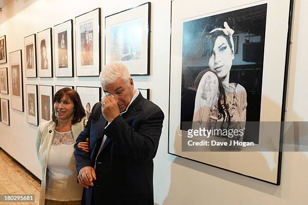 Mitch Winehouse and Janis Winehouse attend the opening of The Amy Winehouse Foundation exhibition to mark her 30th birthday at The Proud Gallery on...