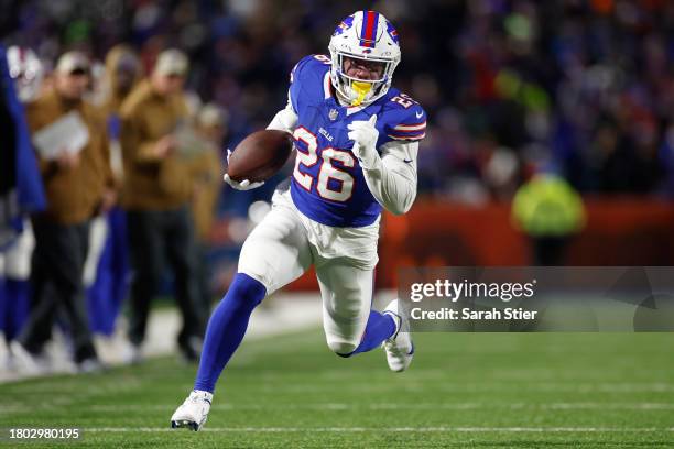Ty Johnson of the Buffalo Bills runs with the ball in the third quarter against the New York Jets at Highmark Stadium on November 19, 2023 in Orchard...