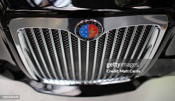 Detail of the grille and insignia of a completed TX4 London Taxi is seen inside the factory of The London Taxi Factory on September 11, 2013 in...