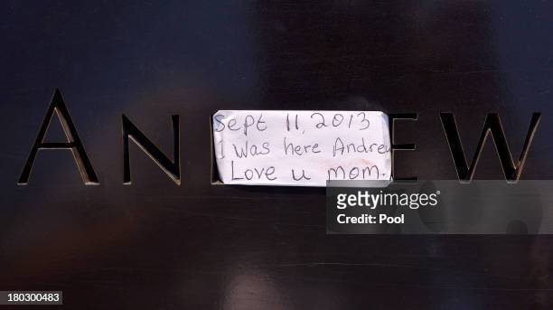 View of a note left on a name at the North Pool at the 9/11 Memorial during ceremonies for the twelfth anniversary of the terrorist attacks on lower...