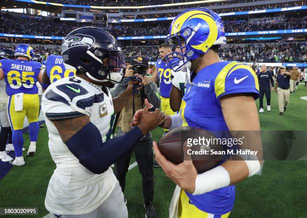 Quandre Diggs of the Seattle Seahawks and Matthew Stafford of the Los Angeles Rams embrace after the game at SoFi Stadium on November 19, 2023 in...