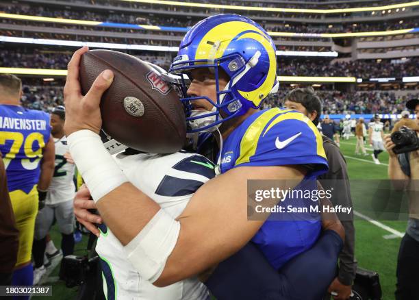 Quandre Diggs of the Seattle Seahawks and Matthew Stafford of the Los Angeles Rams embrace after the game at SoFi Stadium on November 19, 2023 in...