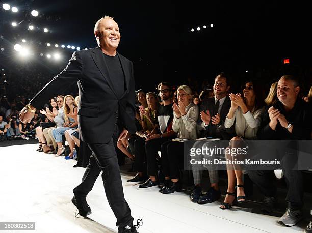 Designer Michael Kors walks the runway during the Michael Kors fashion show during Mercedes-Benz Fashion Week Spring 2014 at The Theatre at Lincoln...