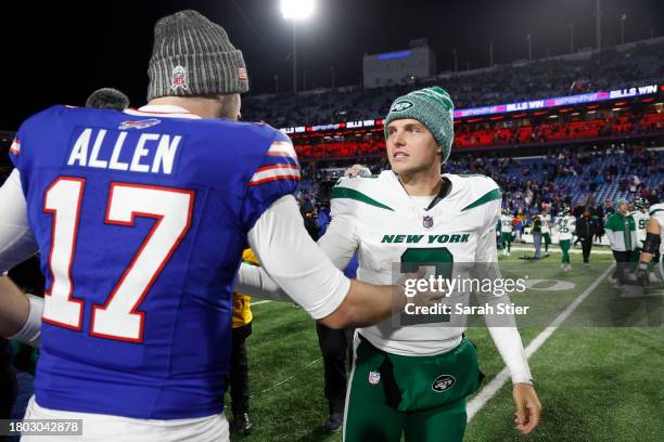 Josh Allen of the Buffalo Bills and Zach Wilson of the New York Jets meet after the Bills beat the Jets 32-6 at Highmark Stadium on November 19, 2023...