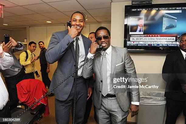 Professional basketball player Carmelo Anthony and rapper P. Diddy attend the annual charity day hosted by Cantor Fitzgerald and BGC at the BGC...