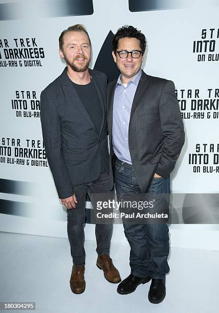 Actor Simon Pegg and Director J.J. Abrams attend the "Star Trek Into Darkness" Blu-ray/DVD release party at the California Science Center on...