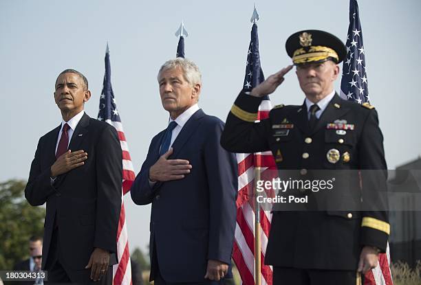 President Barack Obama, U.S. Defense Secretary Chuck Hagel and Chairman of the Joint Chiefs of Staff Martin Dempsey stand during a ceremony in...
