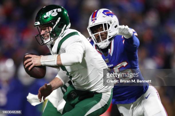 Tim Boyle of the New York Jets drops back to pass while being pressured by Leonard Floyd of the Buffalo Bills in the fourth quarter at Highmark...