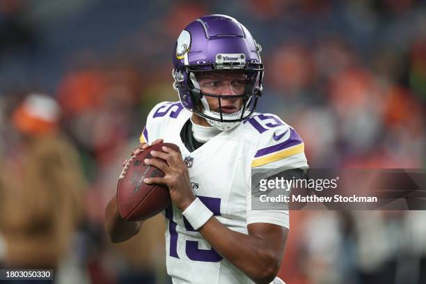 Quarterback Joshua Dobbs of the Minnesota Vikings warms up before the NFL game against the Denver Broncos at Empower Field At Mile High on November...