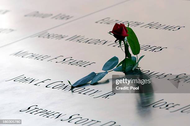 Rose is left by the names engraved in the South Pool of the 9/11 Memorial during ceremonies for the twelfth anniversary of the terrorist attacks on...