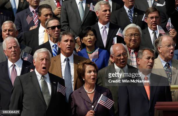 Rep. Steny Hoyer , House Minority Leader Nancy Pelosi , and Speaker of the House John Boehner wave American flags along with other members of...