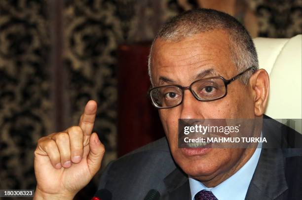 Libyan Prime Minister Ali Zeidan gives a press conference on September 11, 2013 in Tripoli. A car bomb exploded outside a building that once housed...
