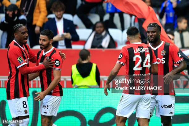 Nice's Nigerian forward Terem Moffi celebrates with teammates after scoring his team's first goal during the French L1 football match between OGC...