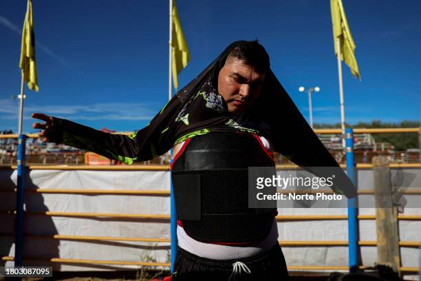 Man gets ready to participate as one of the rodeo clowns during the third competition date of the Sonora Rodeo circuit on November 19, 2023 in...