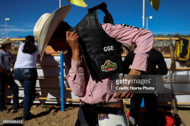 Rough stock rider gets ready to compete during the third competition date of the Sonora Rodeo circuit on November 19, 2023 in Moctezuma, Mexico.