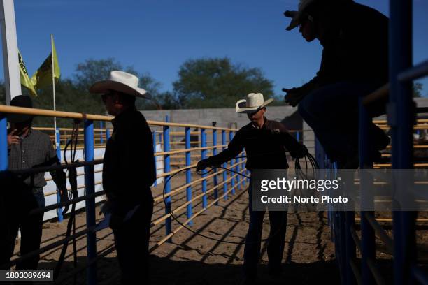 Teenager practices roping in the chutes during the third competition date of the Sonora Rodeo circuit on November 19, 2023 in Moctezuma, Mexico.