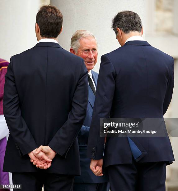 Prince Charles, Prince of Wales talks with Edward van Cutsem as he attends a requiem mass for Hugh van Cutsem who passed away on September 2nd 2013,...