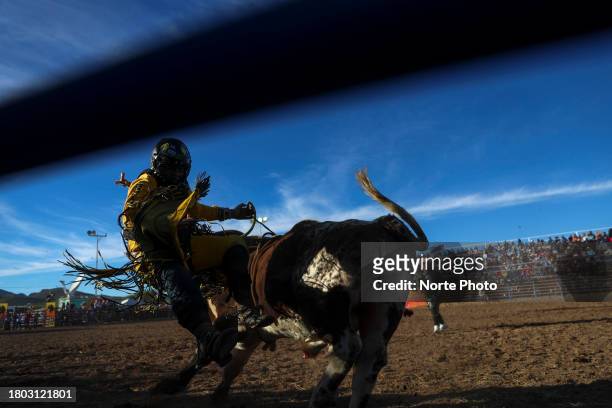 Bull rider Dereck Arellano competes in the bull riding event during the third competition date of the Sonora Rodeo circuit on November 19, 2023 in...