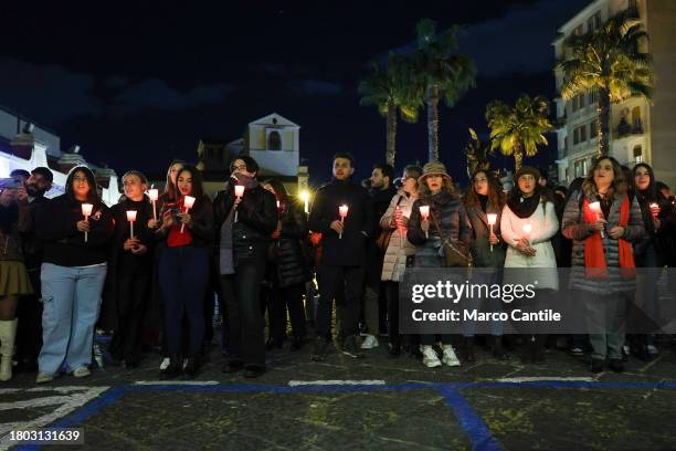 People during a torchlight procession for the International Day for the Elimination of Violence against Women. In Italy the rallies come amid an...