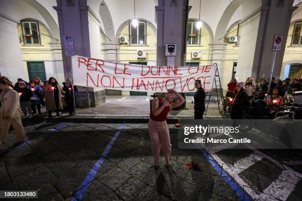 Group of dancers performs during a torchlight procession for the International Day for the Elimination of Violence against Women. In Italy the...