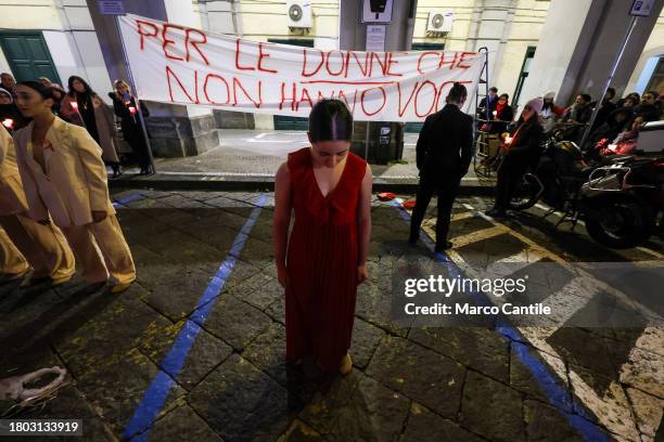 Group of dancers performs during a torchlight procession for the International Day for the Elimination of Violence against Women. In Italy the...