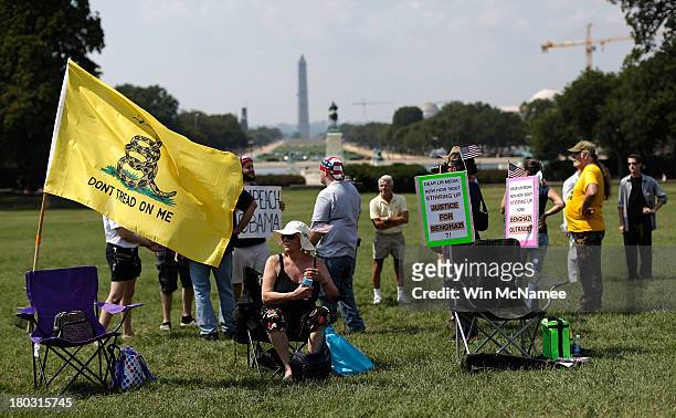 Participants attend a "Call to Action" rally held by various conservative organizations on the grounds of the U.S. Capitol, marking the one year...