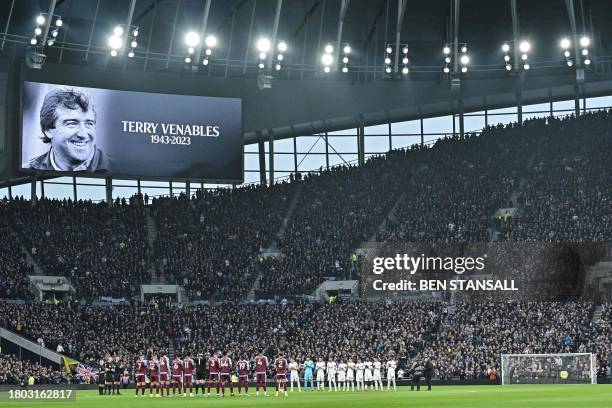 Picture of former England player and coach Terry Venables is shown on the video screen as team players a members of the public pay a tribute for him...