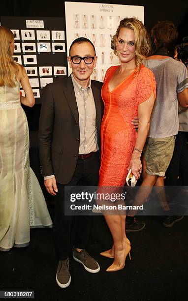 Designer Gilles Mendel and Molly Sims pose backstage at the J. Mendel fashion show during Mercedes-Benz Fashion Week Spring 2014 at The Theatre at...