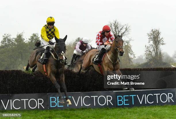 Kildare , Ireland - 26 November 2023; Imagine, right, with Jack Kennedy up, jumps the last on their way to winning the BetVictor Craddockstown Novice...