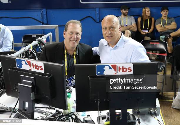 Television announcers Glenn Diamond and Cal Ripken pose for a photo from their field-level provisional setup in the camera bay during MLB game action...