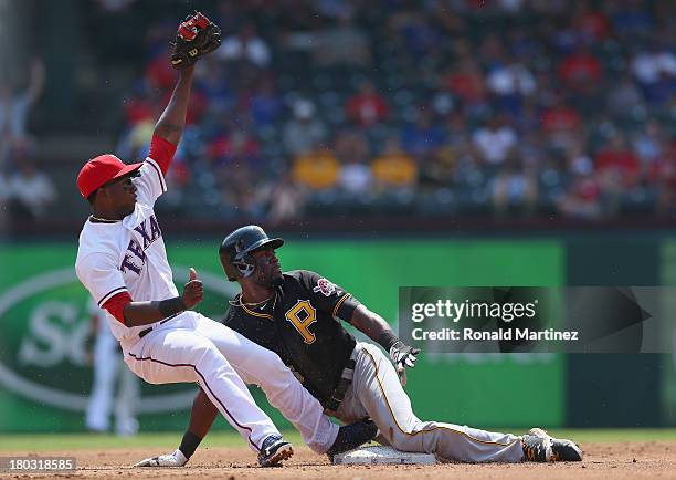 Felix Pie of the Pittsburgh Pirates steals second base against Jurickson Profar of the Texas Rangers at Rangers Ballpark in Arlington on September...