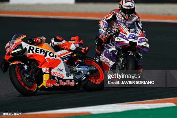 Honda Spanish rider Marc Marquez falls down next to Ducati Spanish rider Jorge Martin during the MotoGP Valencia Grand Prix at the Ricardo Tormo...