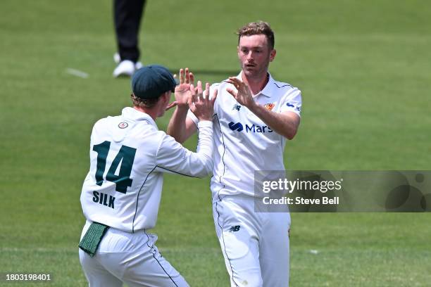 Brad Hope of the Tigers celebrates the wicket of Matthew Gilkes of the Blues during the Sheffield Shield match between Tasmania and New South Wales...