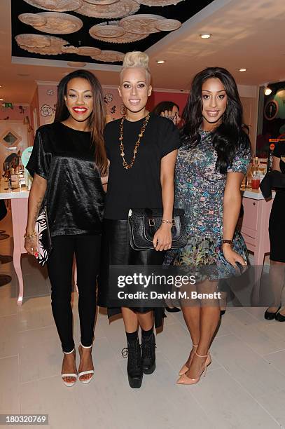 Karis Anderson, Courtney Rumbold and Alexandra Buggs of Stooshe attends the launch of Benefit Cosmetics' new Carnaby Street boutique on September 11,...