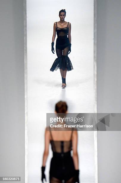 Model walks the runway at the Milly By Michelle Smith fashion show during Mercedes-Benz Fashion Week Spring 2014 at The Stage at Lincoln Center on...