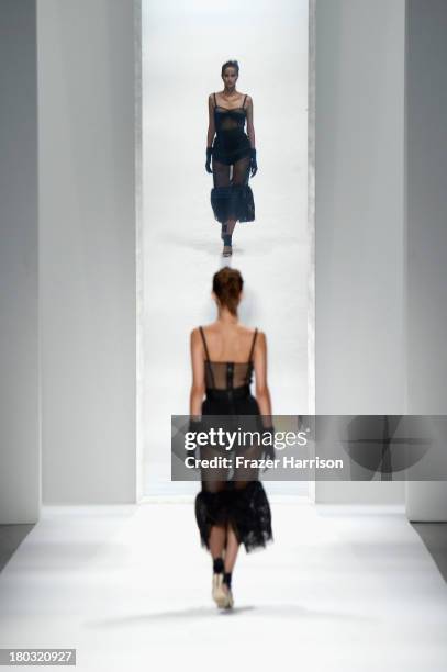 Model walks the runway at the Milly By Michelle Smith fashion show during Mercedes-Benz Fashion Week Spring 2014 at The Stage at Lincoln Center on...