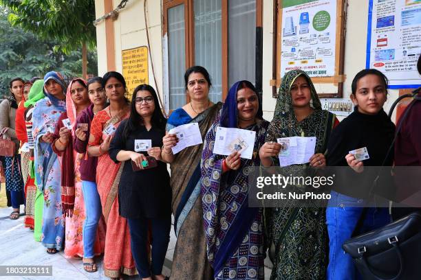 Women are standing in line to cast their votes for the Rajasthan Assembly elections in Jaipur, Rajasthan, India, on November 25, 2023.