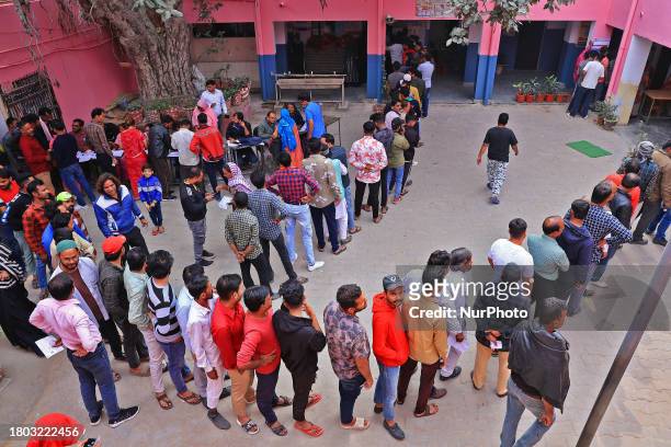 People are standing in queues to cast their votes for the Rajasthan Assembly elections in Jaipur, Rajasthan, India, on November 25, 2023.