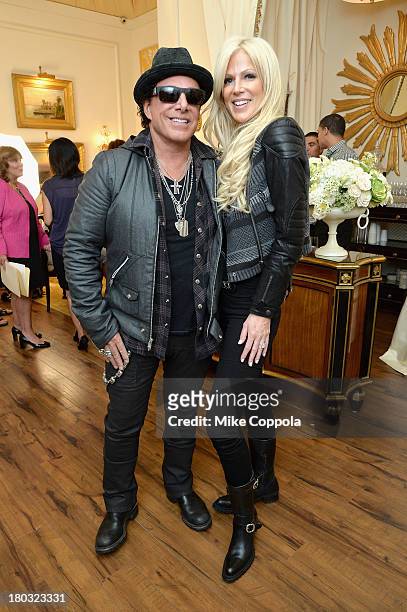 Musician Neal Schon and fiancé Michaele Salahi attend the Mercedes-Benz Star Lounge during Mercedes-Benz Fashion Week Spring 2014 on September 11,...