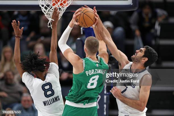 Kristaps Porzingis of the Boston Celtics goes to the basket against Santi Aldama of the Memphis Grizzlies during the second half at FedExForum on...