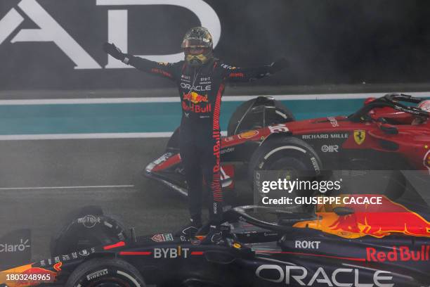 Red Bull Racing's Dutch driver Max Verstappen celebrates winning the Abu Dhabi Formula One Grand Prix at the Yas Marina Circuit in the Emirati city...