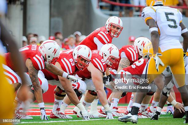 Quarterback Taylor Martinez of the Nebraska Cornhuskers and his offensive line prepare to snap the ball during their game against the Southern Miss...