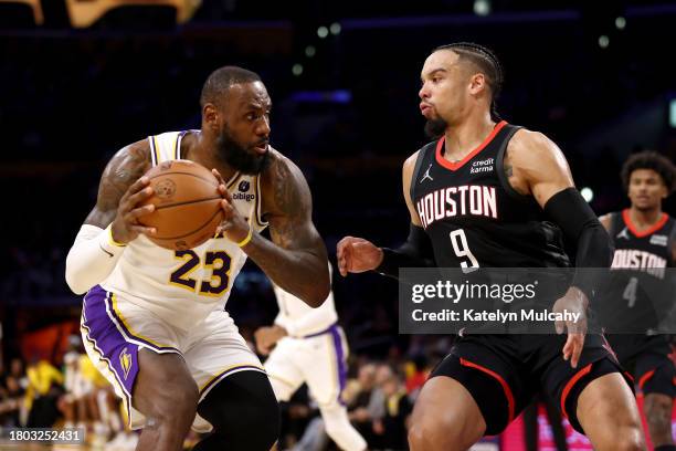 LeBron James of the Los Angeles Lakers drives to the basket against Dillon Brooks of the Houston Rockets during the second quarter at Crypto.com...