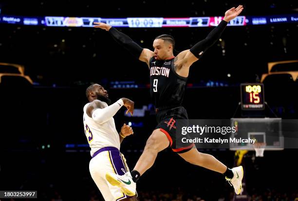 Dillon Brooks of the Houston Rockets attempts to block a pass against LeBron James of the Los Angeles Lakers during the first quarter at Crypto.com...