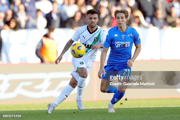 Matheus Henrique of US Sassuolo in action against Jacopo Fazzini of Empoli FC during the Serie A TIM match between Empoli FC and US Sassuolo at...