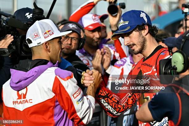 Ducati Italian rider Francesco Bagnaia shakes hands with Ducati Spanish rider Jorge Martin after winning the MotoGP Valencia Grand Prix at the...