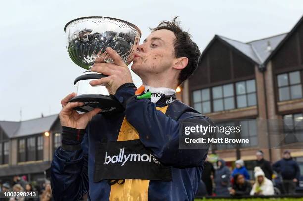 Kildare , Ireland - 26 November 2023; JJ Slevin with the John Durkan Memorial Cup after winning the John Durkan Memorial Punchestown Steeplechase...