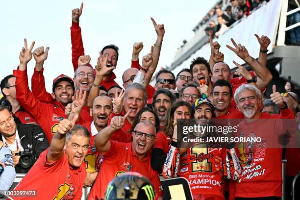 Ducati Italian rider Francesco Bagnaia celebrates with his team after winning the MotoGP Valencia Grand Prix at the Ricardo Tormo racetrack in...