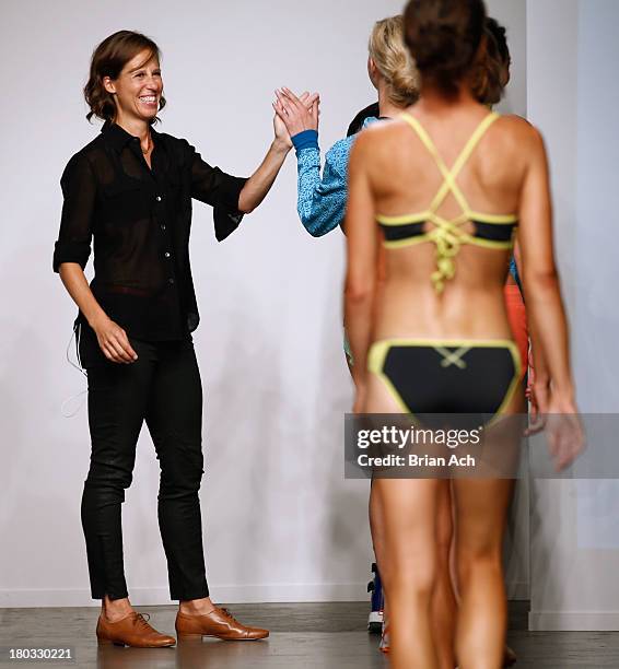 Designer Sally Bergesen walks the runway at the Oisellei show during Nolcha Fashion Week New York Spring/Summer 2014 presented by RUSK at Pier 59...